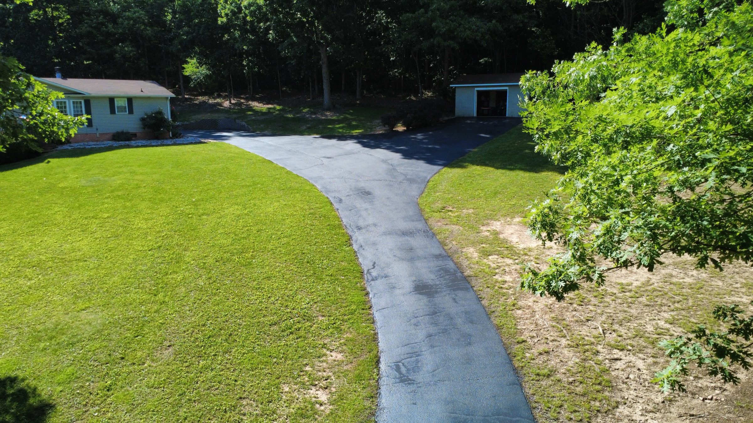 Drone view of a sealcoated residential driveway