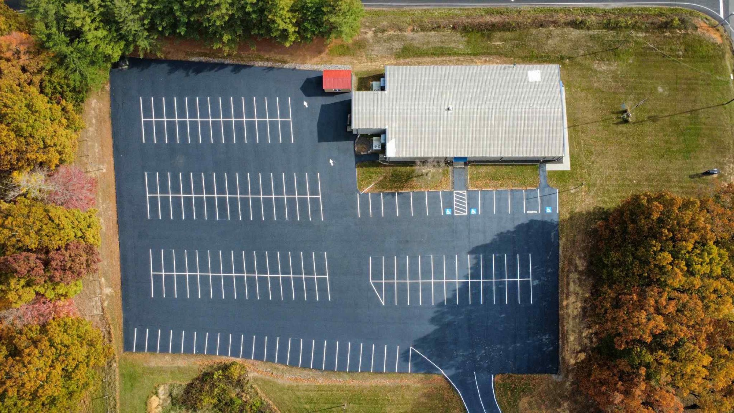 Drone top-down view of a striped parking lot