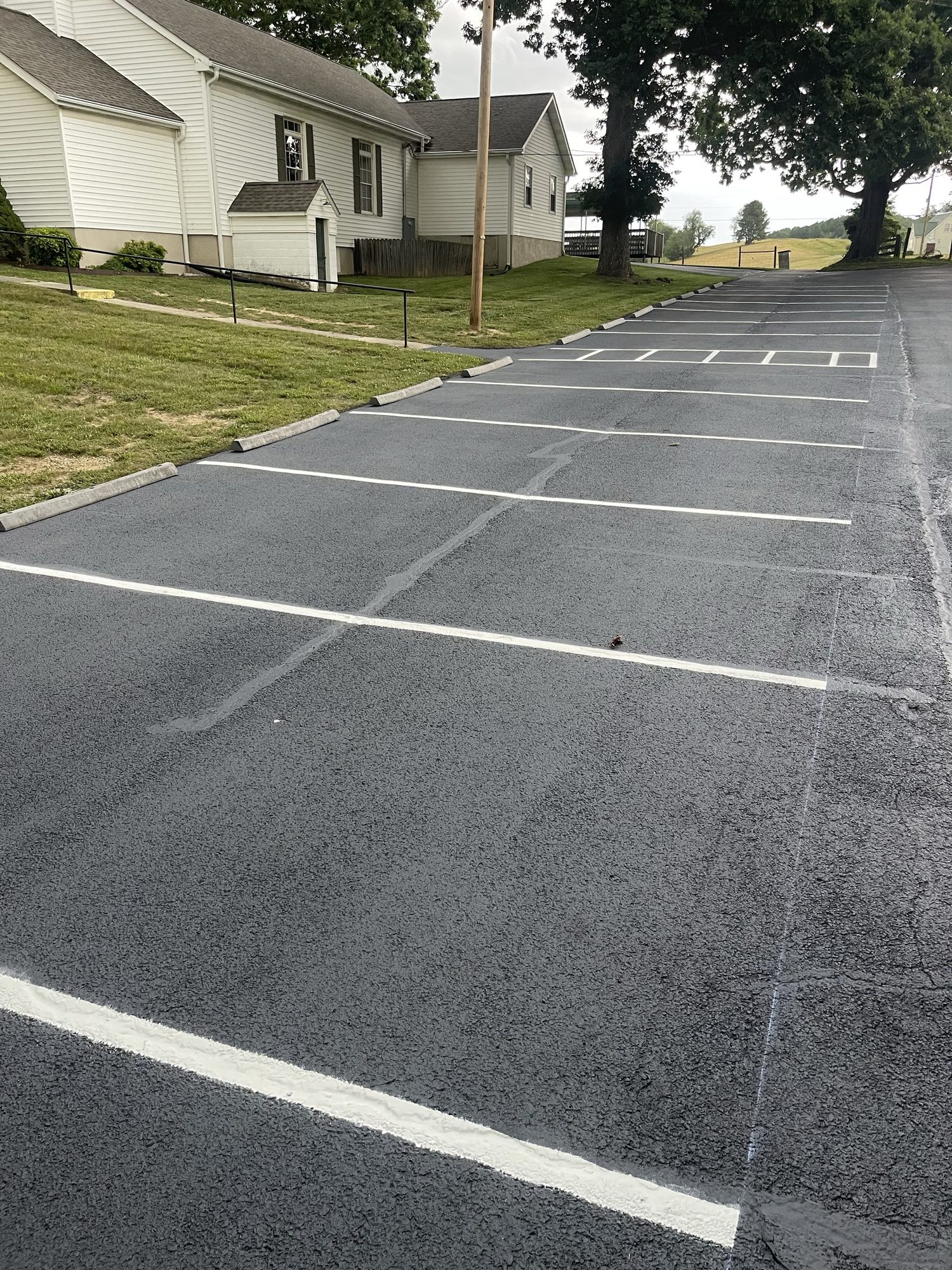 Crisp white striping detail on fresh asphalt