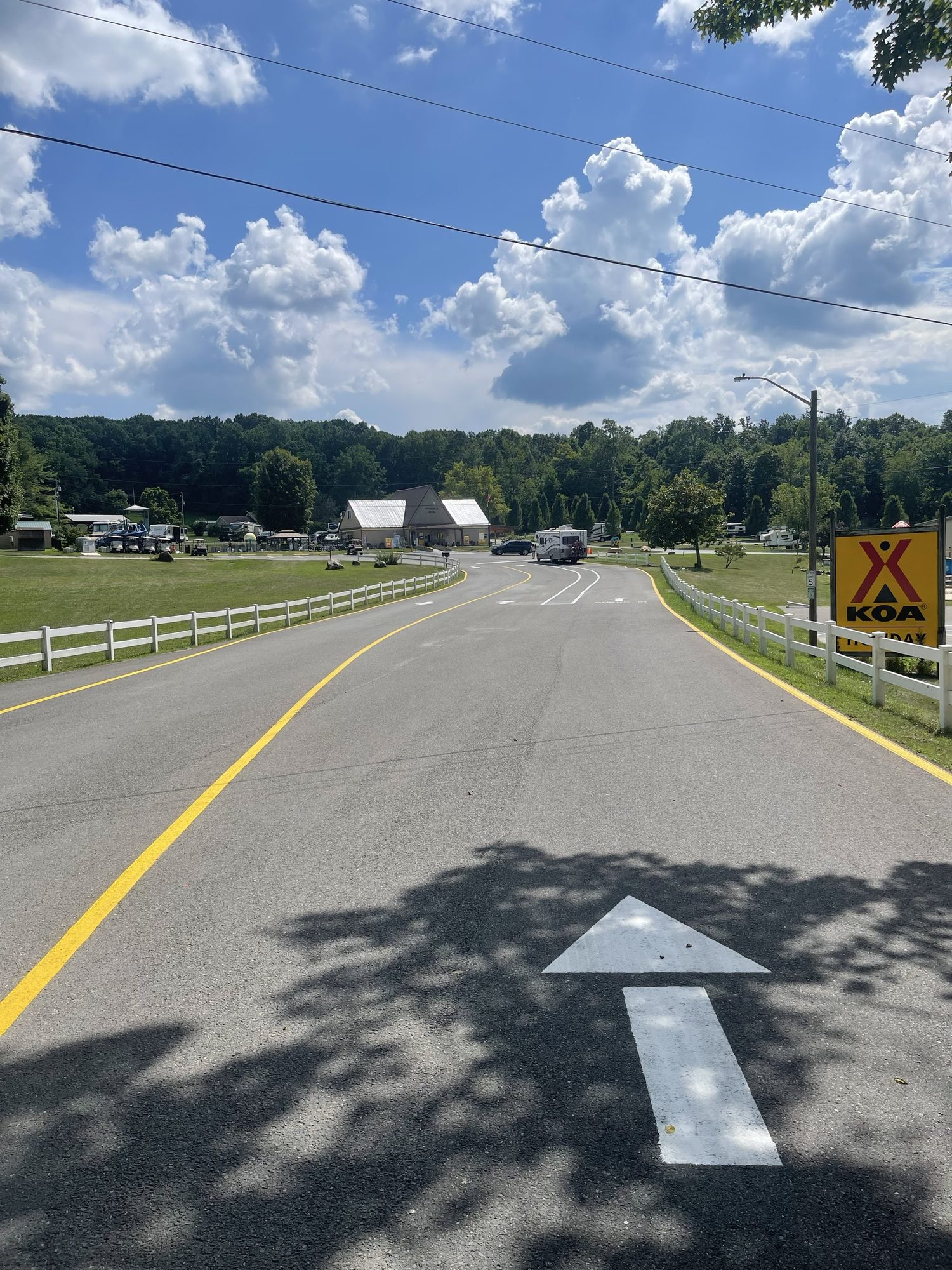 Directional arrow and yellow center line on a road